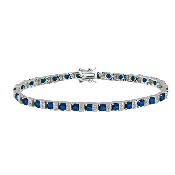 .925 ITALIAN SILVER RHODIUM DIPPED TENNIS BRACELET WITH BLUE AND CLEAR CZ STONES.